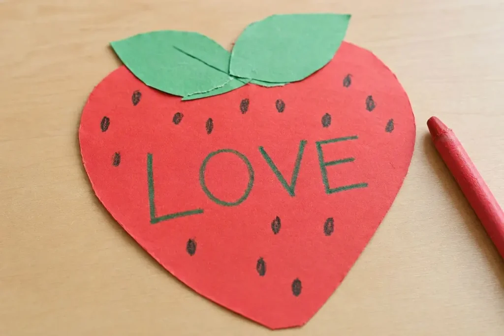 Printable Fruit of the Spirit Love coloring page and strawberry craft activity for kids learning Galatians 5:22 in Sunday school or homeschool.