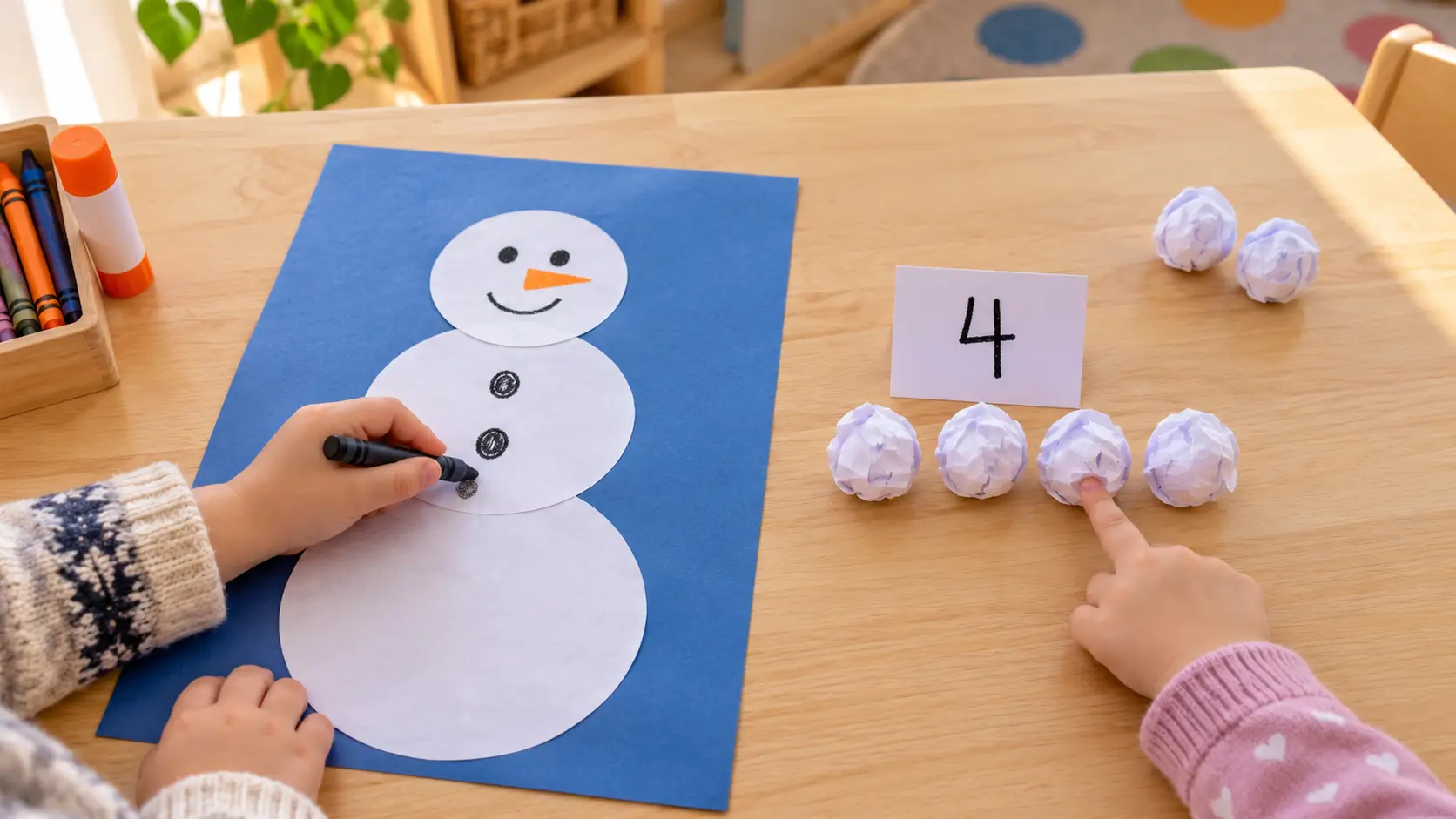 Winter activities for preschoolers with children decorating a paper snowman and counting paper snowballs.